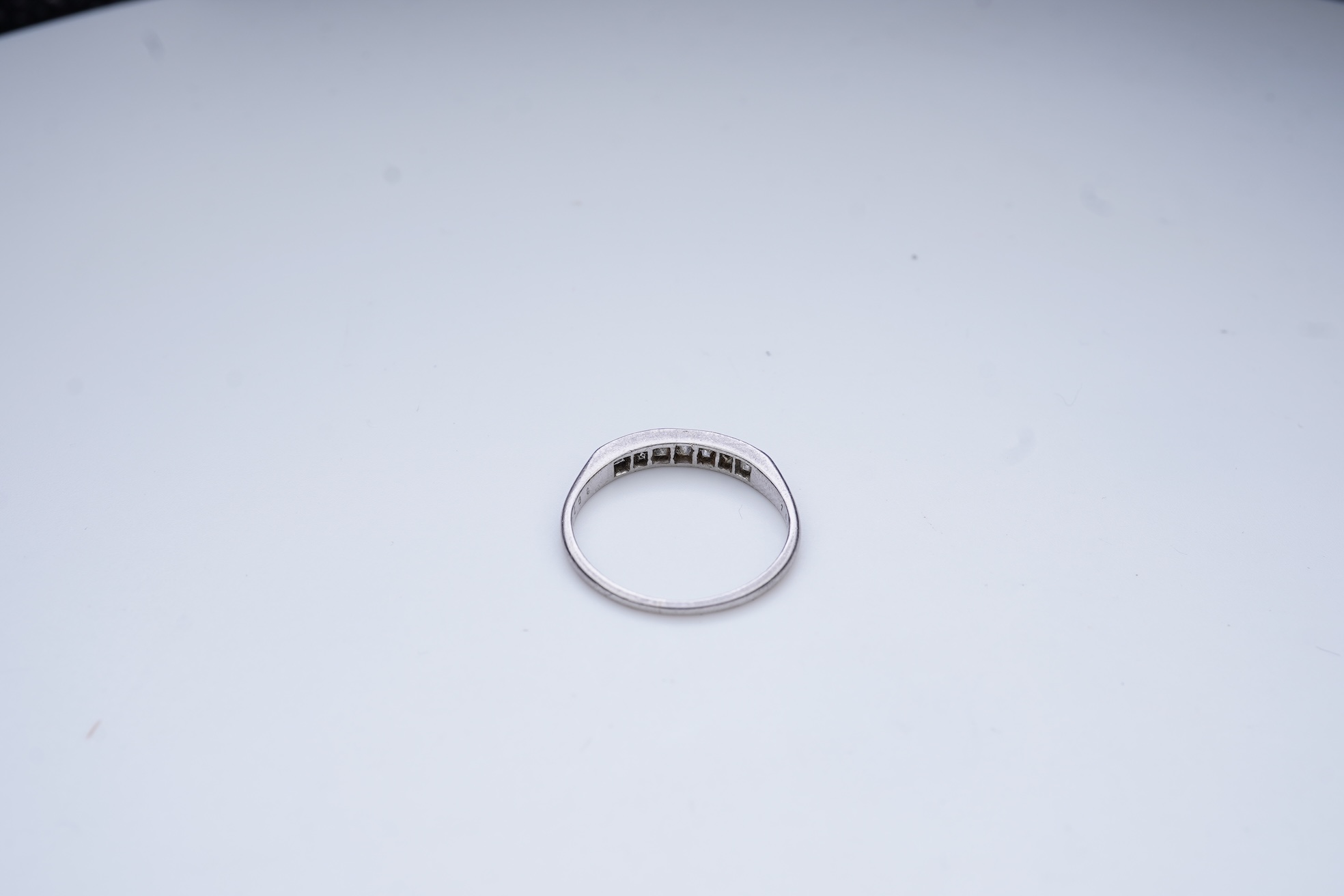 A diamond half-eternity ring, first half 20th century